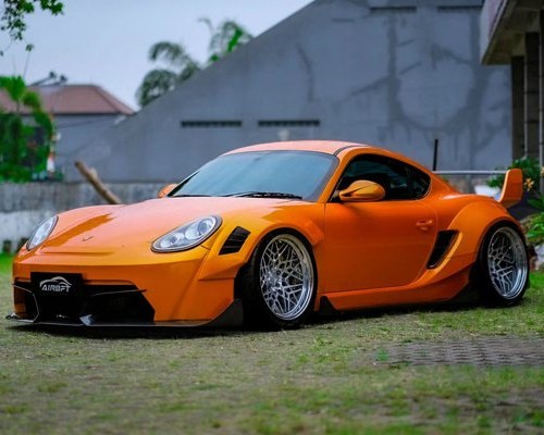 orange porsche cayman 987 airride extreme low lying