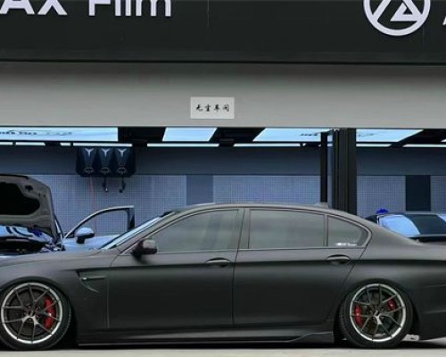 The grey BMW 5 Series F18 airbft airride is perfectly low on display
